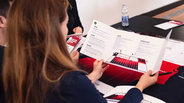 Person reading a brochure