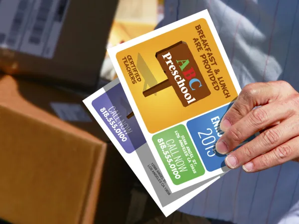 a person holding a postcard
