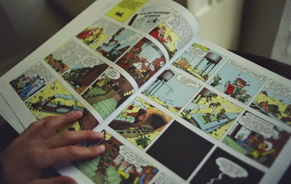 a hand holding a book