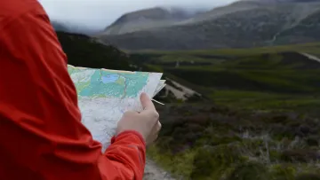 a person holding a map