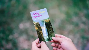 a person holding a card